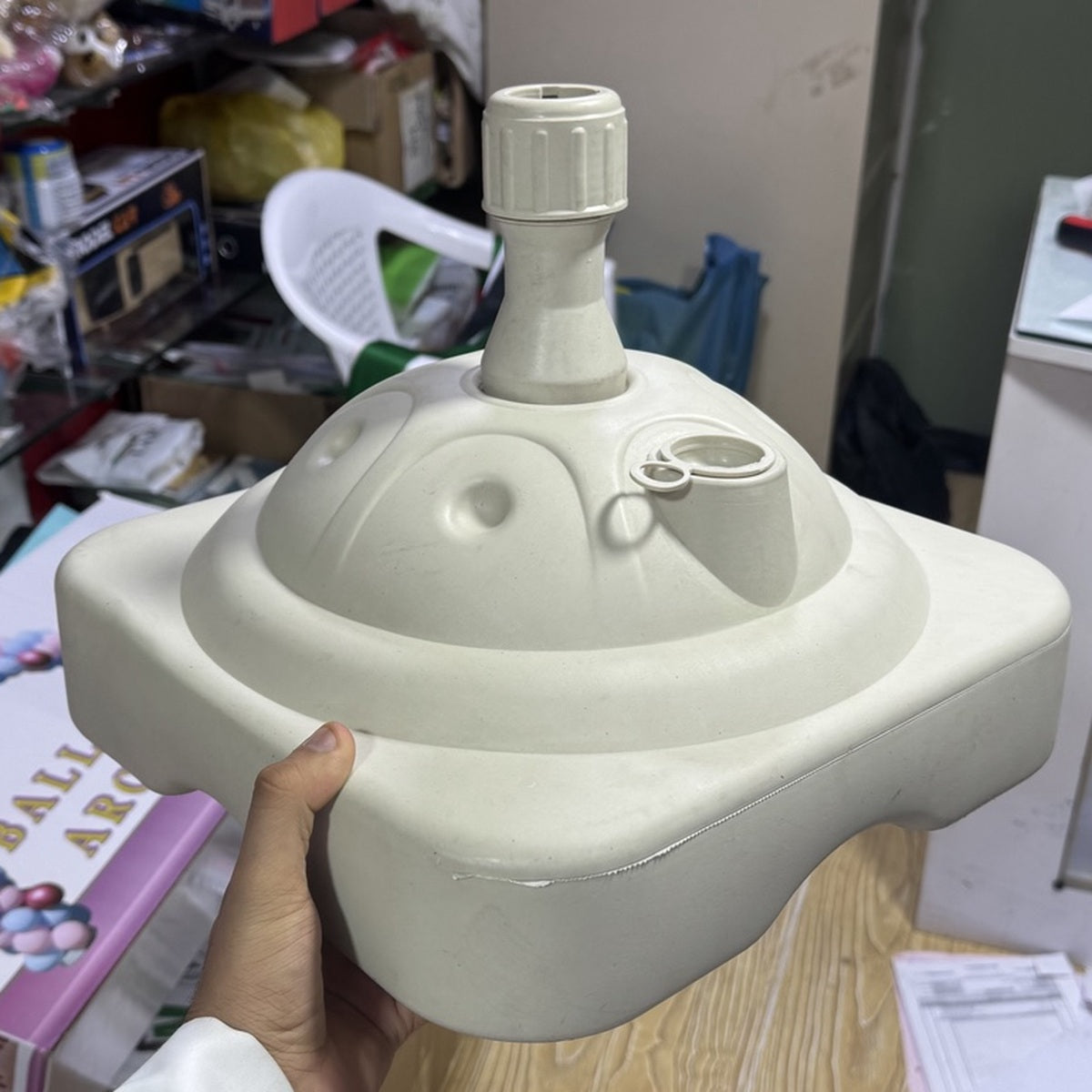 Actual white water-fillable flag and umbrella holder base from front
