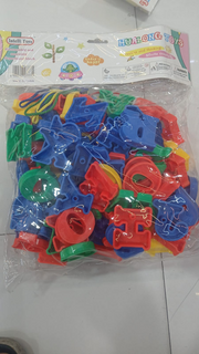 Bag of colourful plastic alphabet letter pieces with lacing cords
