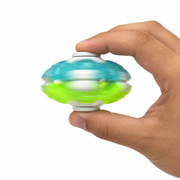 Hand pressing the white buttons of a turquoise and lime green gyro fidget ball while it spins
