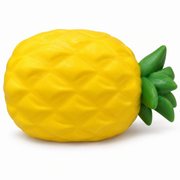 AI-enhanced image: Yellow pineapple squishy with a textured oval body and green leaf crown; original supplied photo included