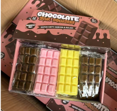 Original supplier photo: Chocolate-bar-shaped squishies shown in brown, pink and yellow