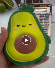 Original supplier photo: Green avocado character squishy with a brown pit, pink cheeks and a smiling face