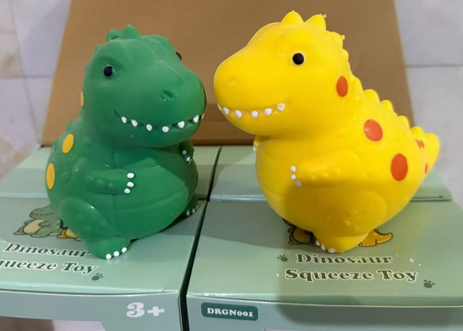 Original supplier photograph of green and yellow dinosaur squishy toys SH3662