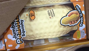 Original supplier photo: Pale cream jumbo peanut-shaped squishy with a dimpled shell texture