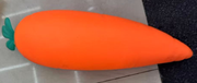 Original supplier photo: Smooth orange carrot squishy with a small green leaf tuft